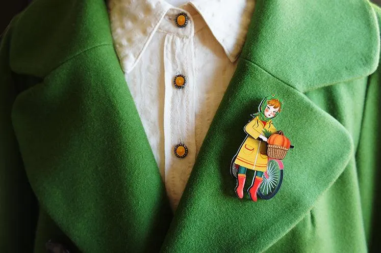 Girl with bicycle brooch by Laliblue
