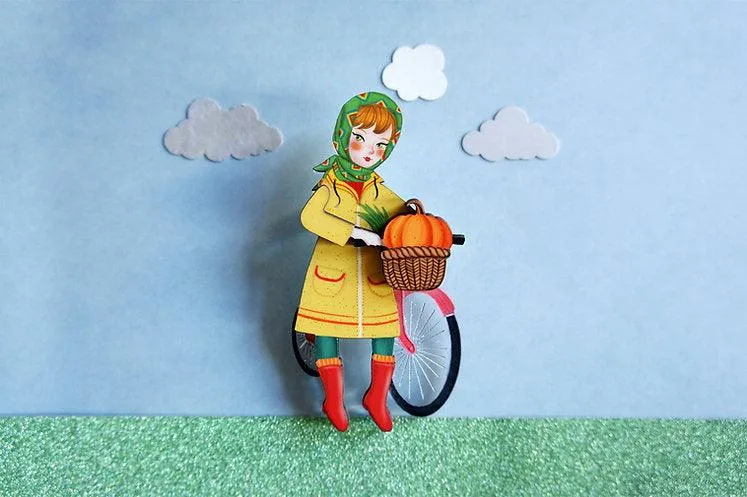 Girl with bicycle brooch by Laliblue